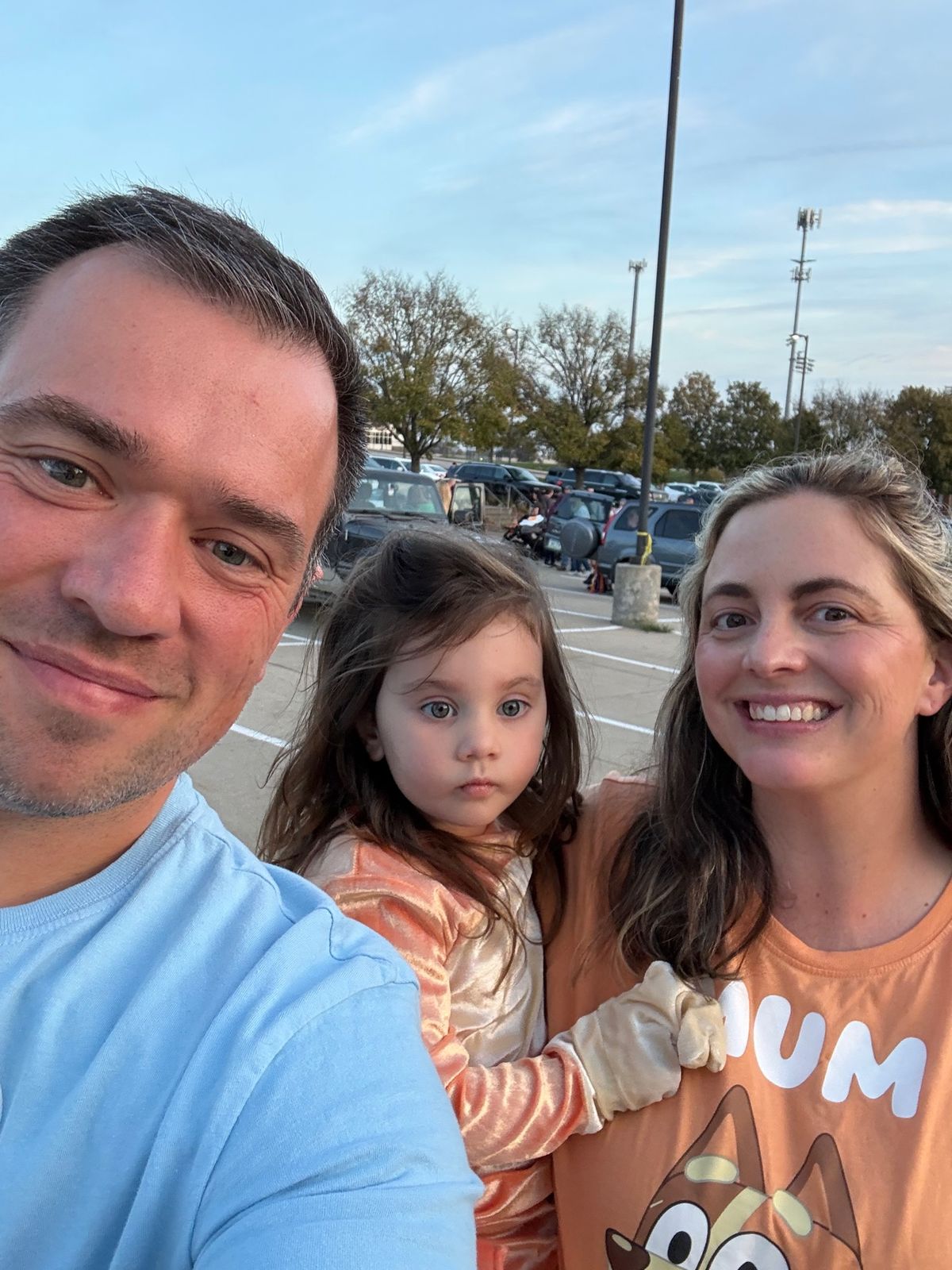 Kyle, Vera, and Mandy in their Bluey family costumes at trunk-or-treat